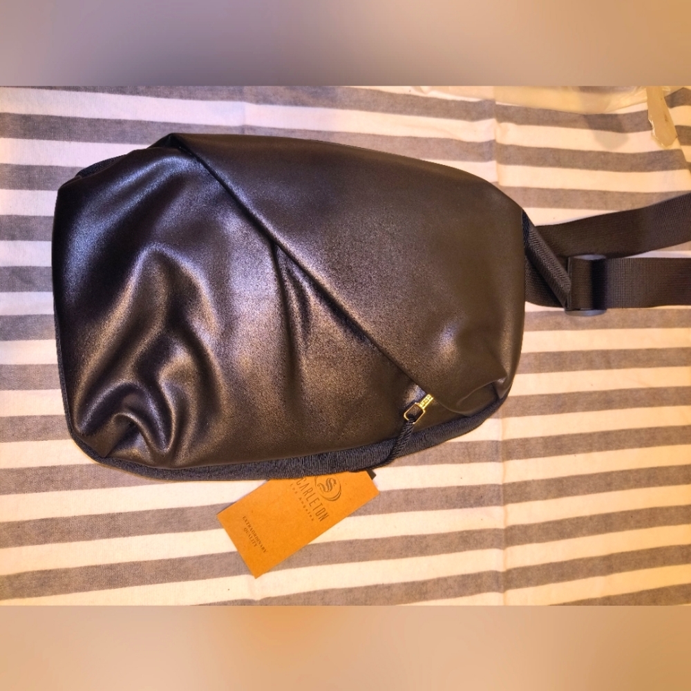 Black scarleton reverse shoulder bag